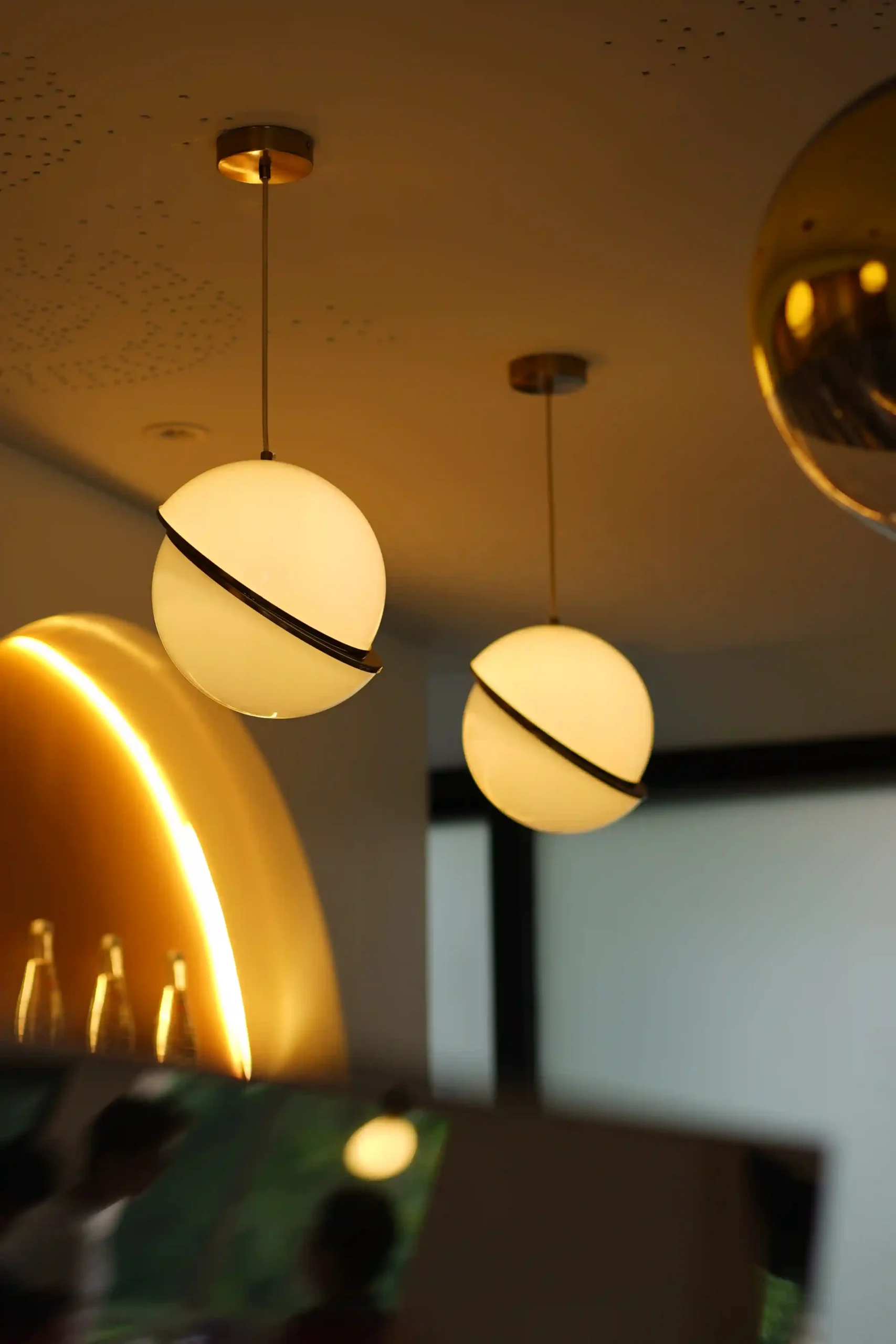 Modern pendant lights and ambient lighting details at Lunavera Space.
